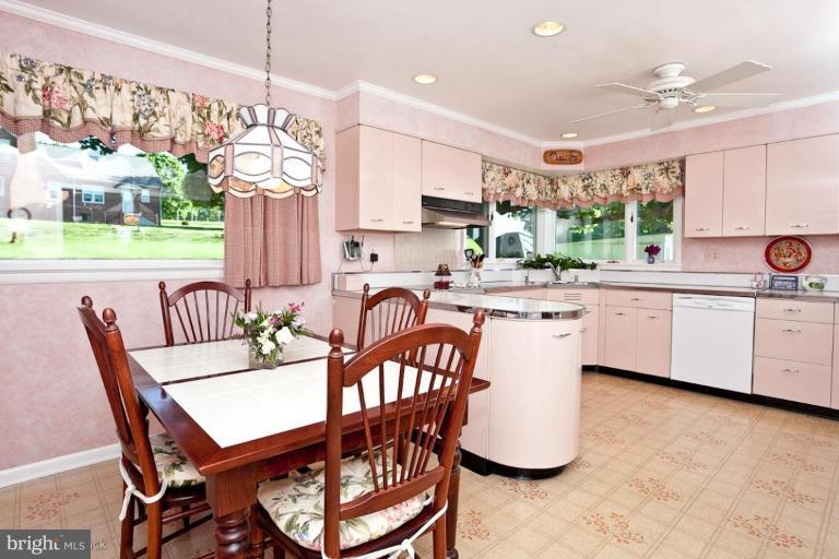 3754 Black Rock Road Upperco, MD 21155 - Photo 7 of 18 a kitchen with stainless steel appliances granite countertop a dining table chairs and a large window