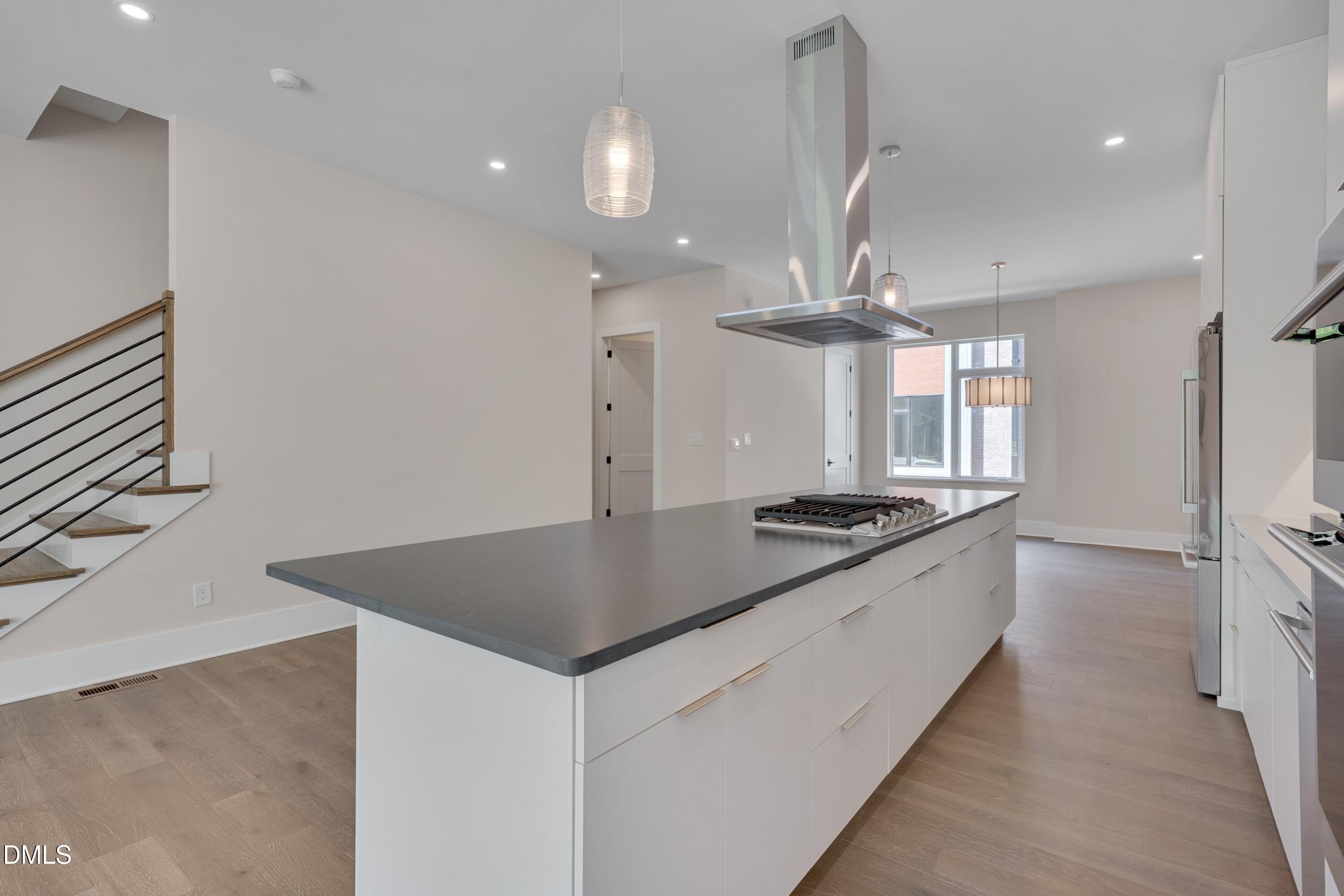1014 Manor Way Durham, NC 27701 - Photo 11 of 38 a kitchen with stainless steel appliances granite countertop a sink a stove and a refrigerator