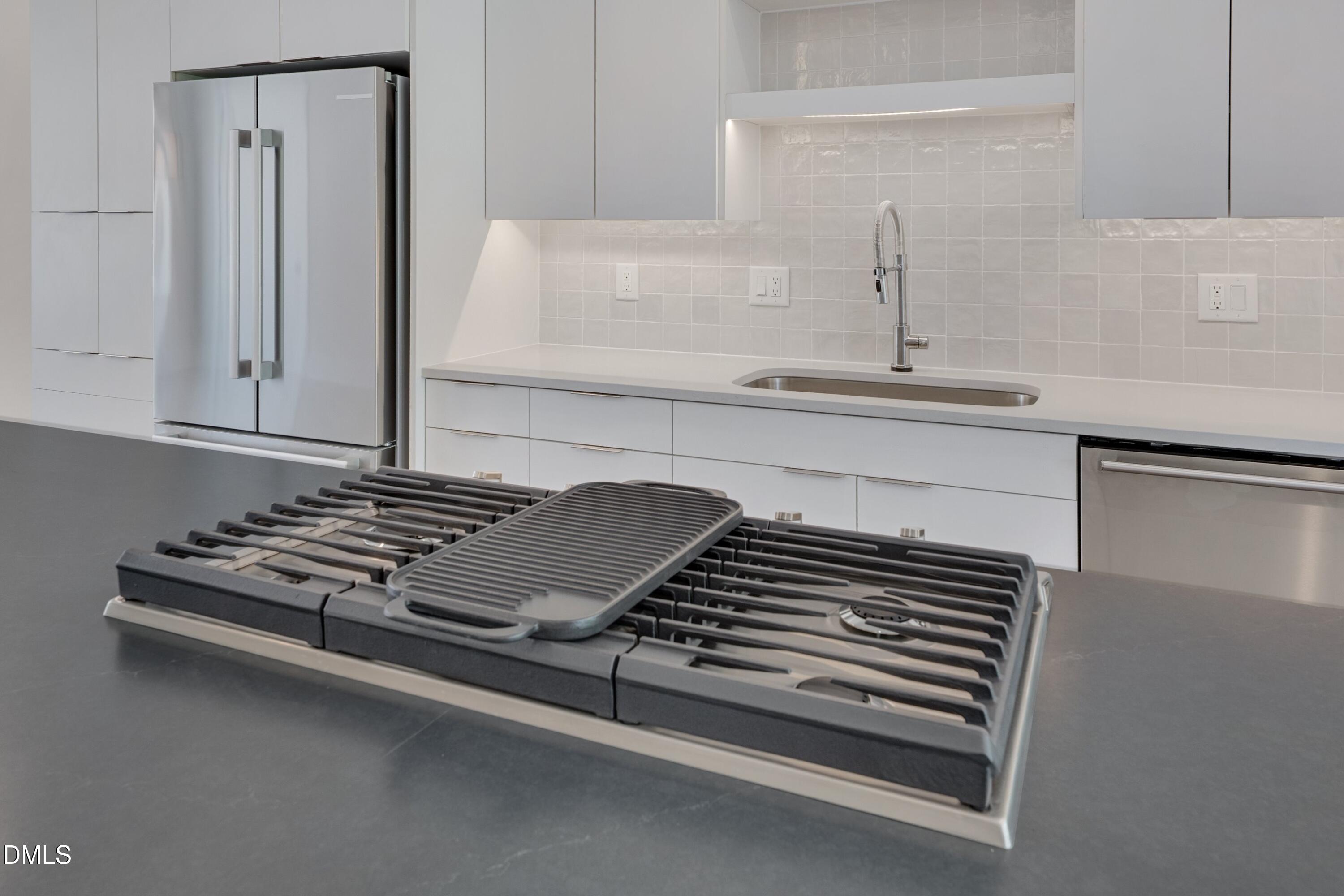 1014 Manor Way Durham, NC 27701 - Photo 13 of 38 a stove top oven sitting inside of a kitchen