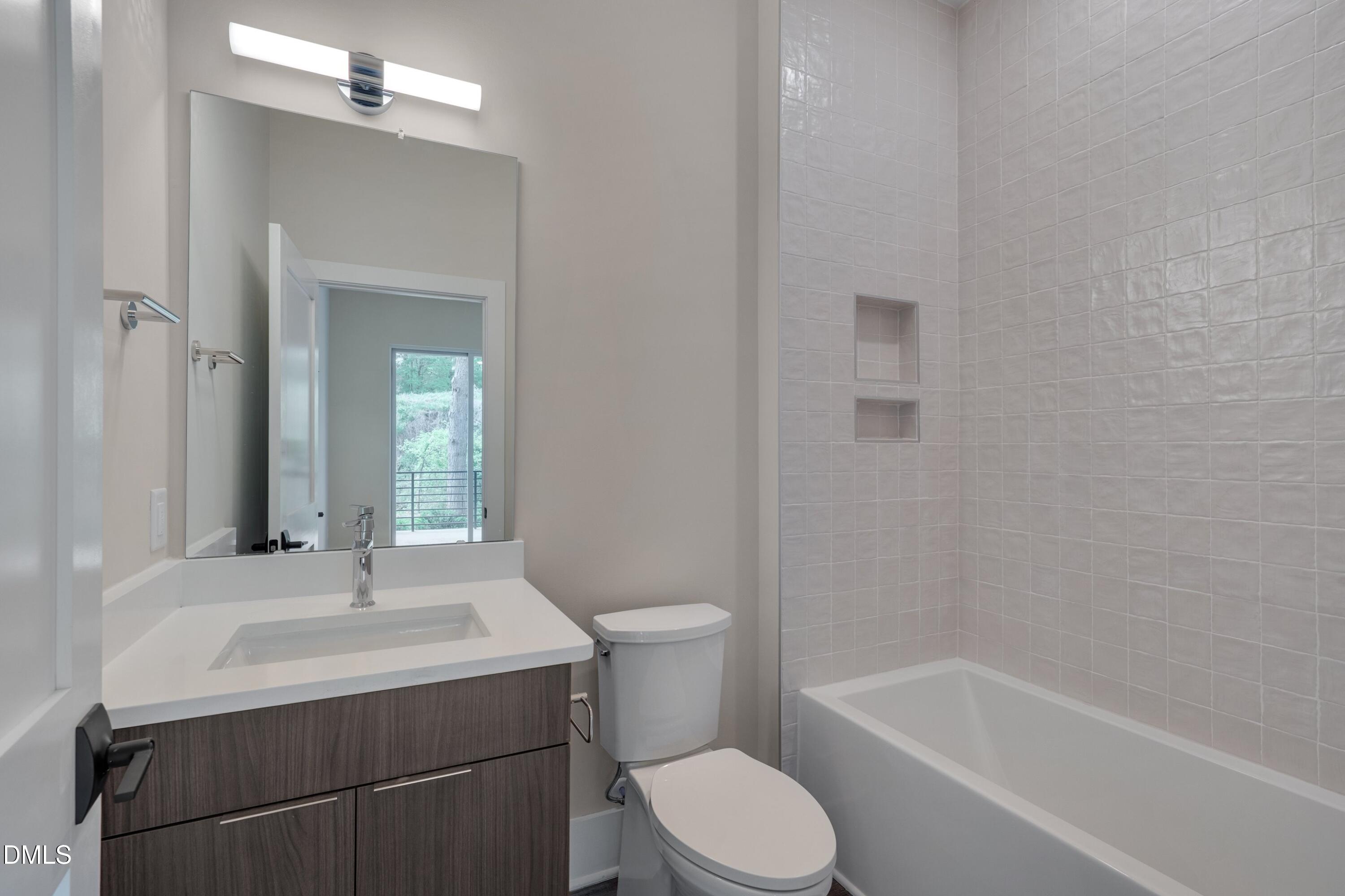 1014 Manor Way Durham, NC 27701 - Photo 13 of 46 a bathroom with a sink toilet and shower