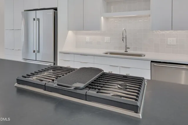 a view of a room with stairs and a hallway