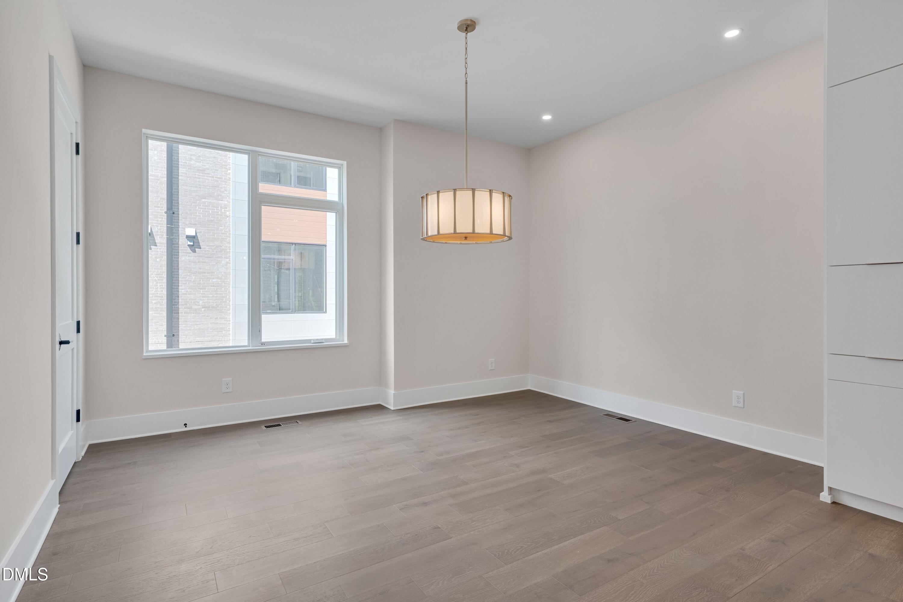 1014 Manor Way Durham, NC 27701 - Photo 16 of 38 a view of an empty room with a window