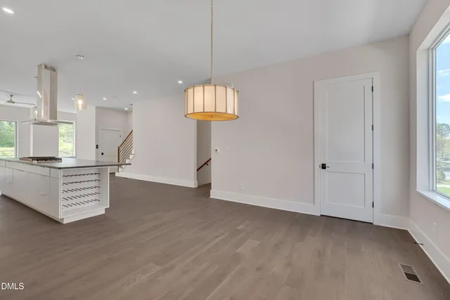 a bathroom with a shower sink and mirror