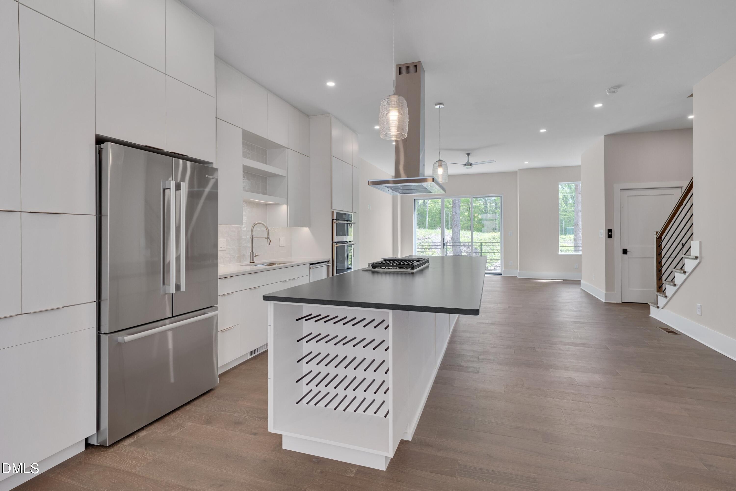 1014 Manor Way Durham, NC 27701 - Photo 20 of 46 a kitchen with stainless steel appliances granite countertop a refrigerator a sink and a refrigerator