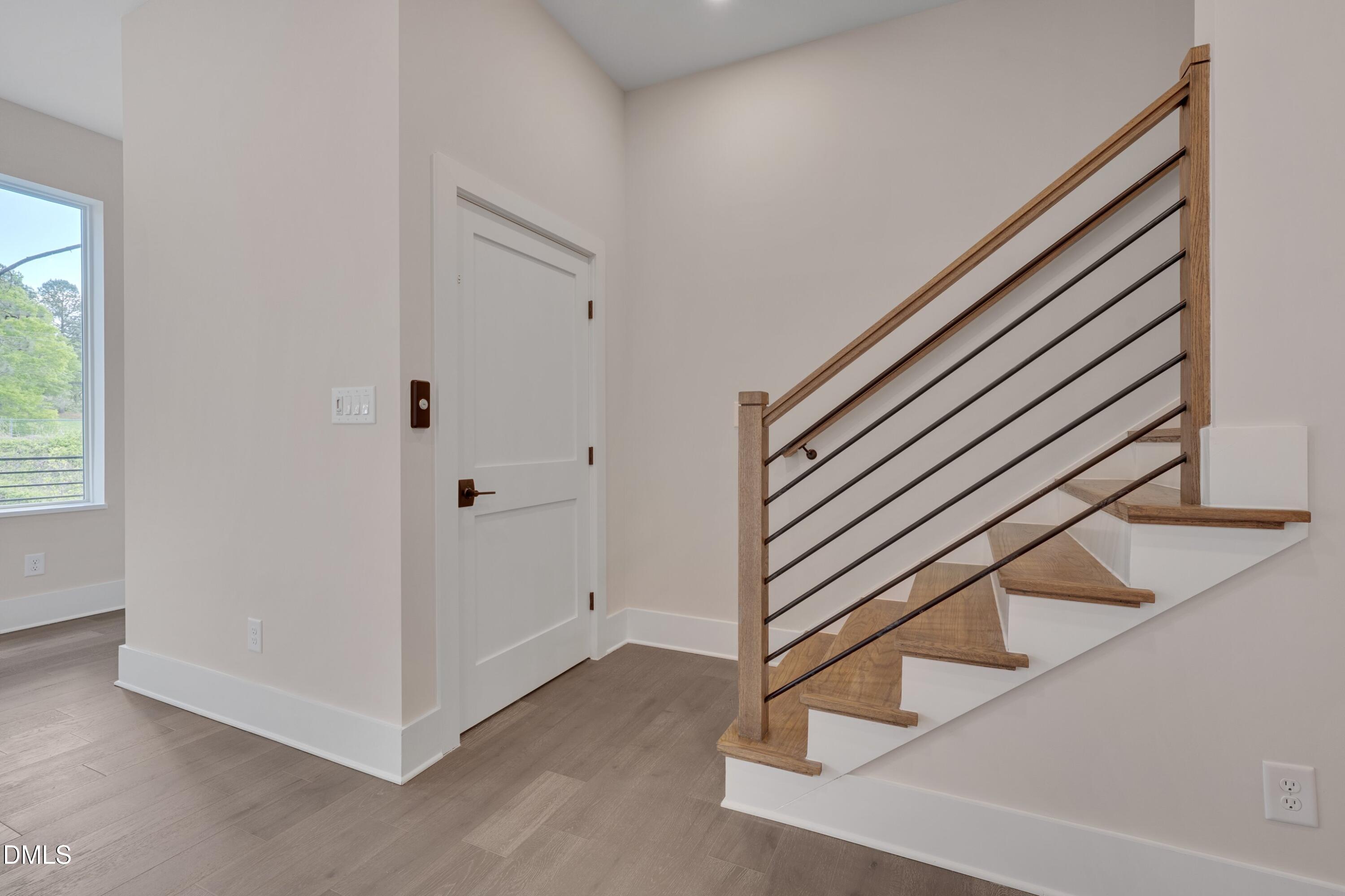 1014 Manor Way Durham, NC 27701 - Photo 22 of 38 a view of a room with stairs and a hallway
