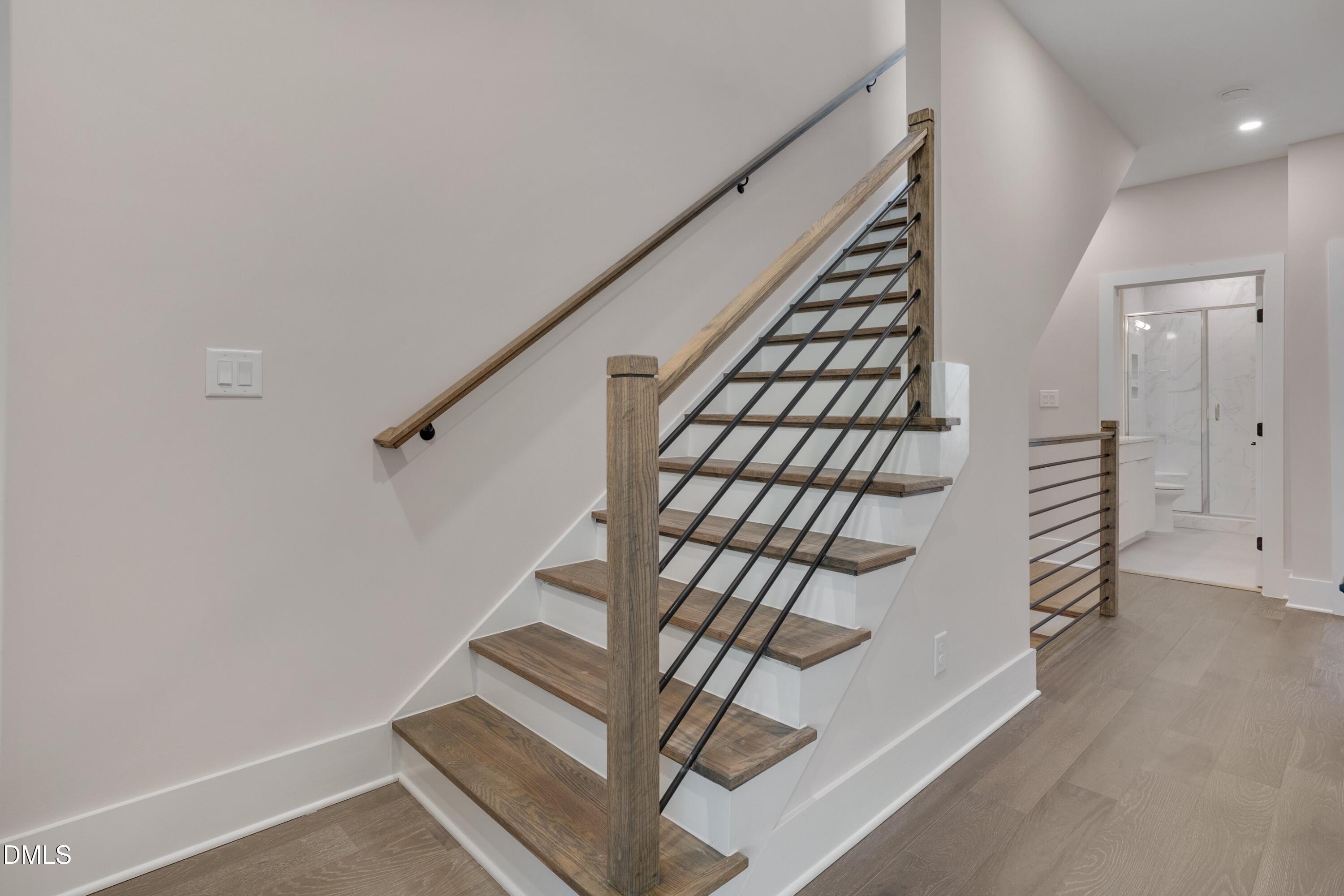 1014 Manor Way Durham, NC 27701 - Photo 29 of 38 a view of entryway with stairs and wooden floor