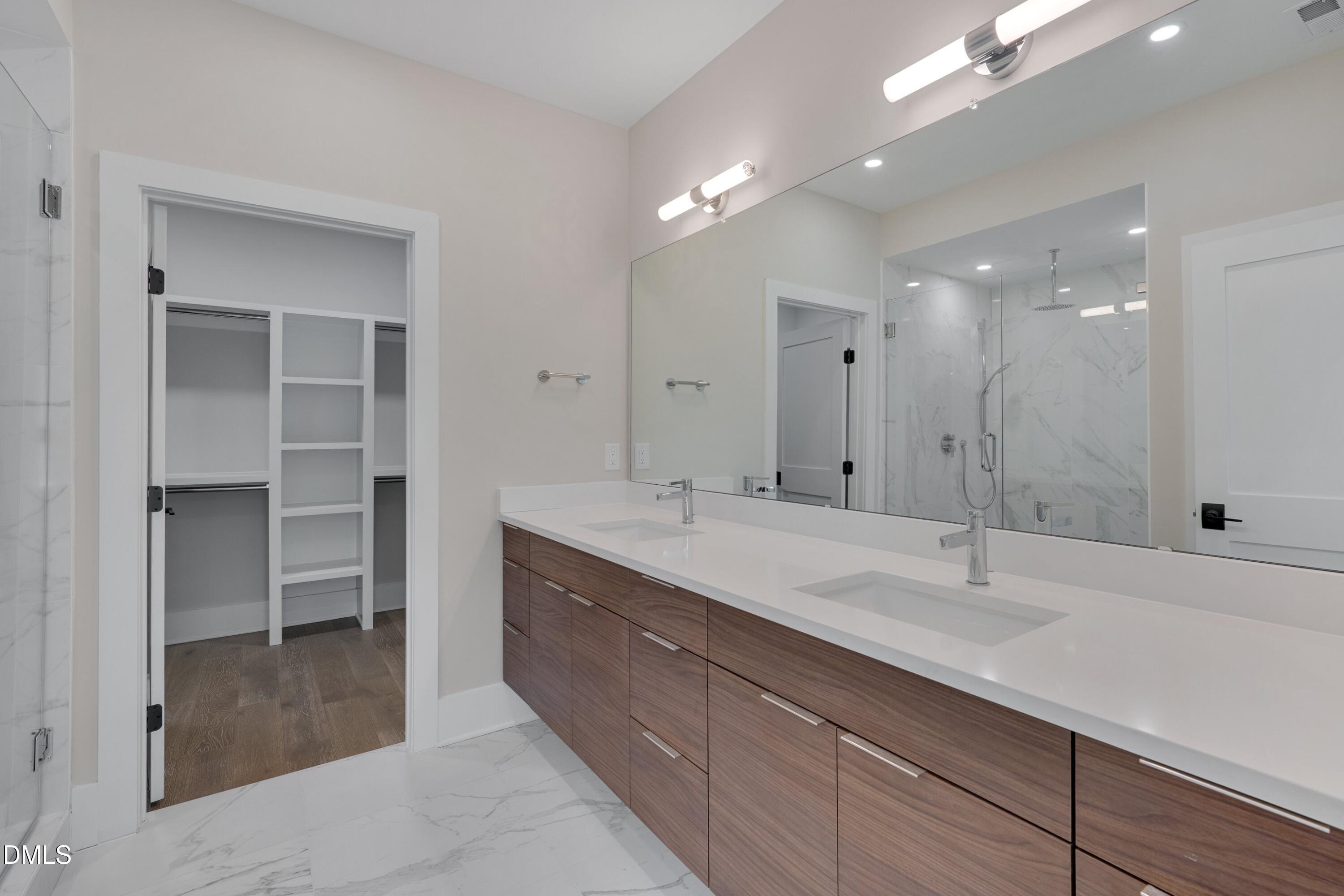 1014 Manor Way Durham, NC 27701 - Photo 32 of 46 a bathroom with a double vanity sink and a mirror
