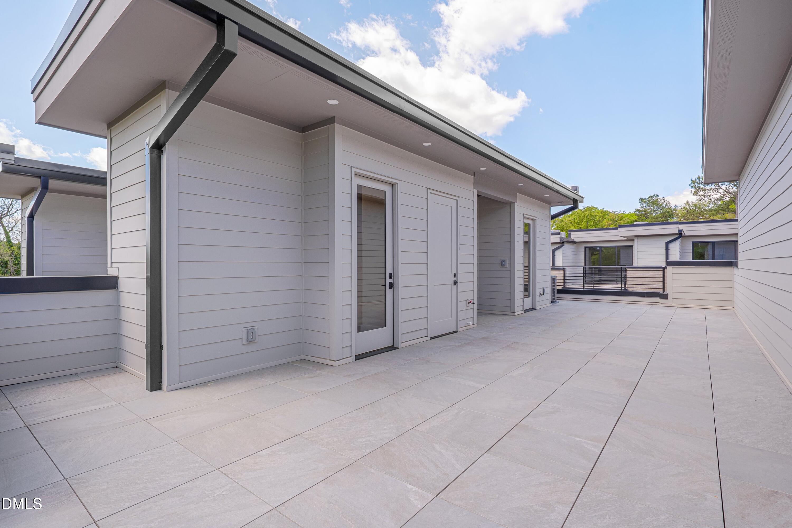 1014 Manor Way Durham, NC 27701 - Photo 35 of 38 a view of a house with a backyard and a garage