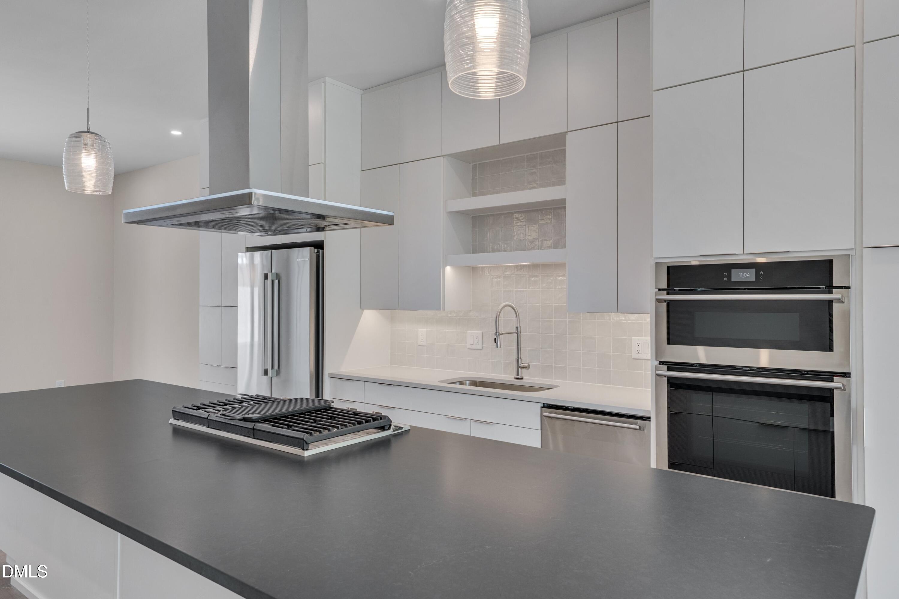 1014 Manor Way Durham, NC 27701 - Photo 9 of 38 a stove top oven sitting inside of a kitchen