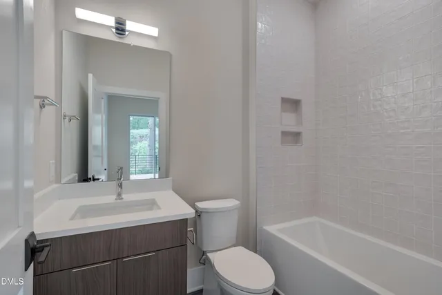 a kitchen with stainless steel appliances granite countertop a refrigerator a sink and a refrigerator