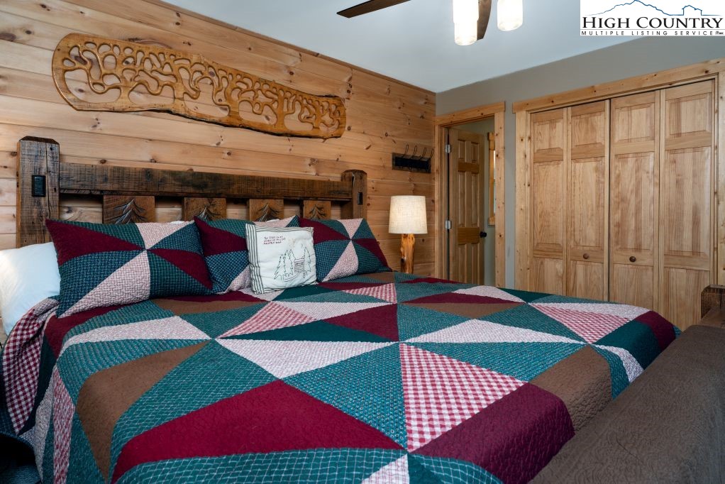 25 Red Oak Road Newland, NC 28657 - Photo 36 of 45 a bedroom with a bed and a painting on the wall