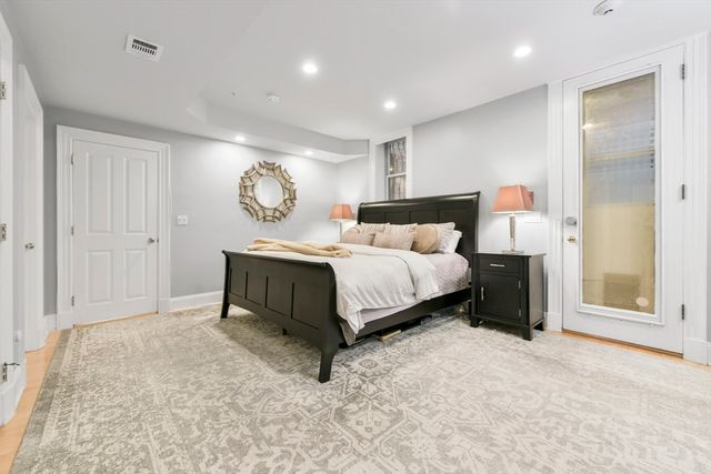 a bedroom with bed and window