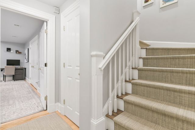 a bedroom with furniture and a fireplace