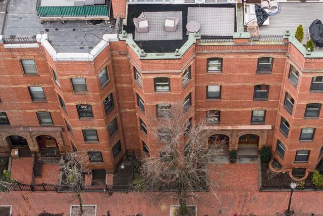 a large building with a street sign on it
