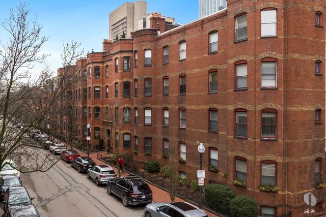 a view of water with tall building