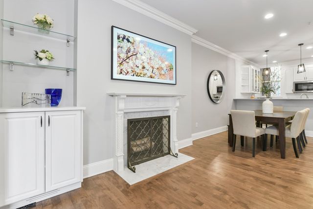 a view of a livingroom with furniture and a fireplace