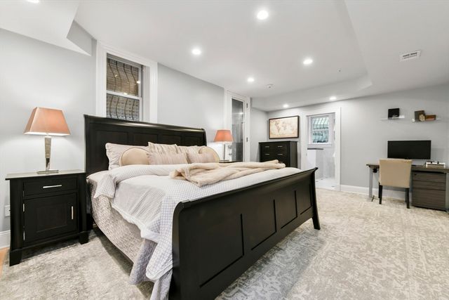 a bedroom with a bed and a cabinets