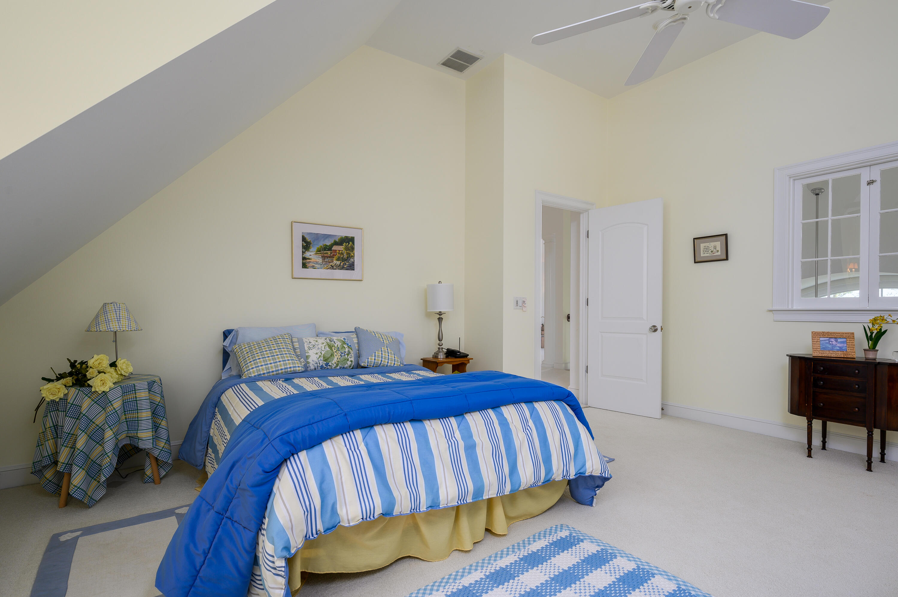 286 Cairn Ridge Road East Falmouth, MA 02536 - Photo 54 of 70 a bedroom with a bed and a table in it