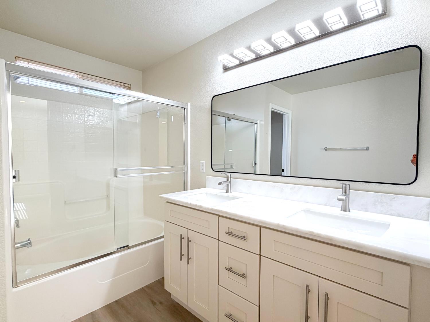7948 Cavalier Way Sacramento, CA 95832 - Photo 12 of 17 a bathroom with a shower sink and mirror