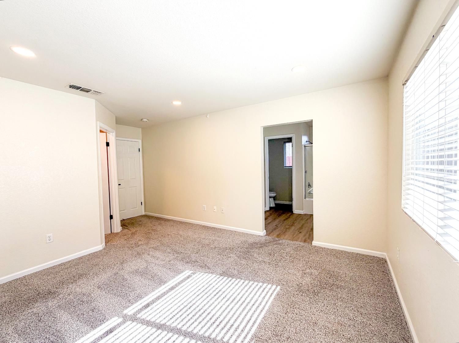 7948 Cavalier Way Sacramento, CA 95832 - Photo 14 of 17 a view of an empty room with a window