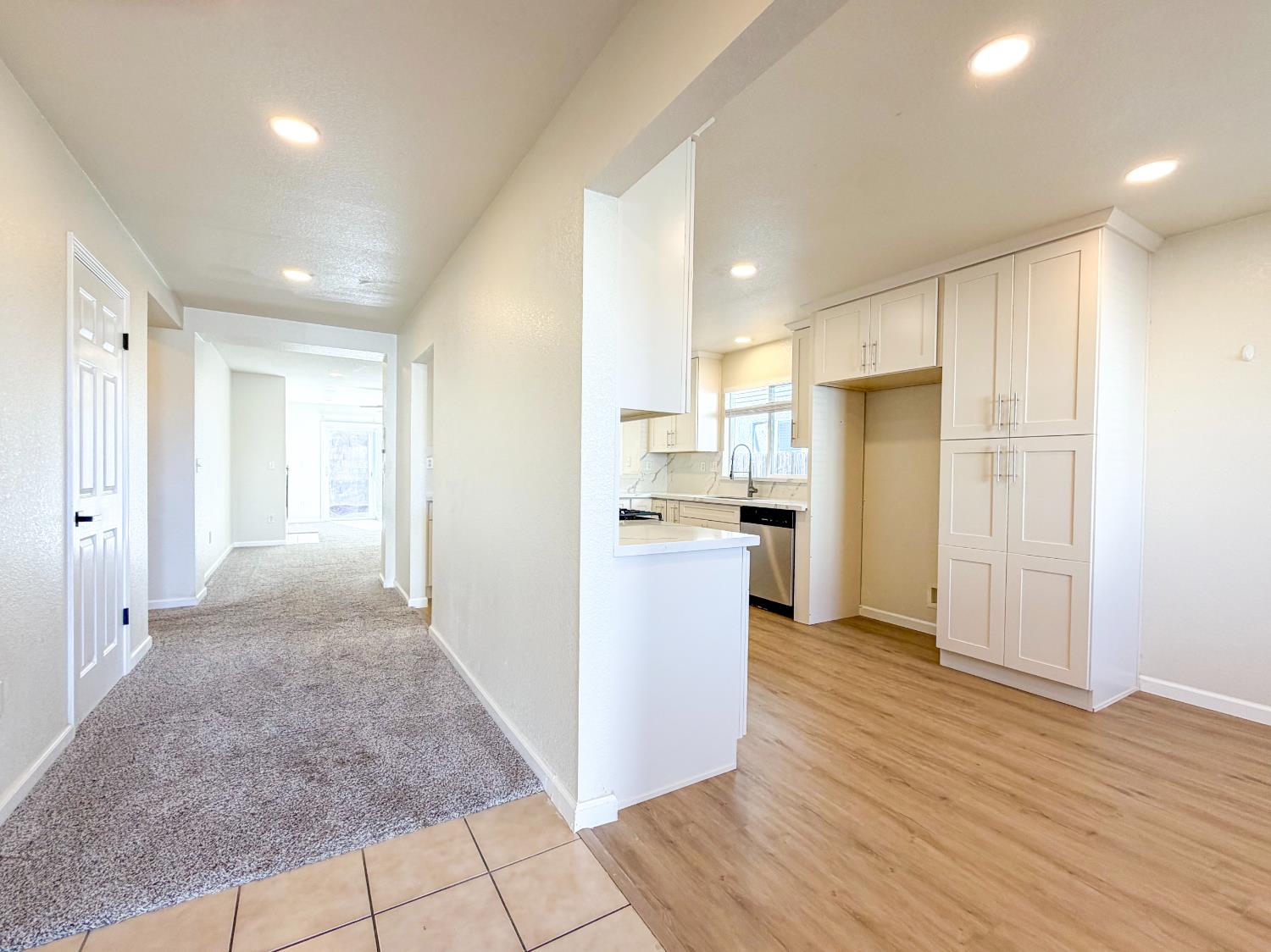 7948 Cavalier Way Sacramento, CA 95832 - Photo 2 of 17 a view of a kitchen with refrigerator and wooden floor