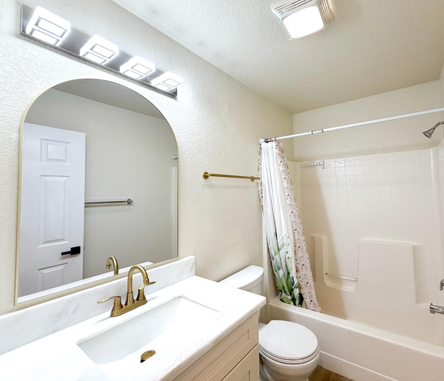 7948 Cavalier Way Sacramento, CA 95832 - Photo 8 of 17 a bathroom with a sink a toilet and shower