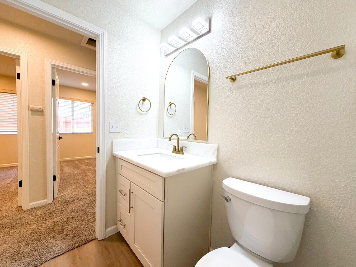 7948 Cavalier Way Sacramento, CA 95832 - Photo 9 of 17 a bathroom with a granite countertop sink toilet and shower