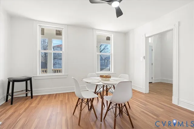 a view of a dining room with furniture window and wooden floor