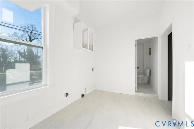 a view of an empty room with a window