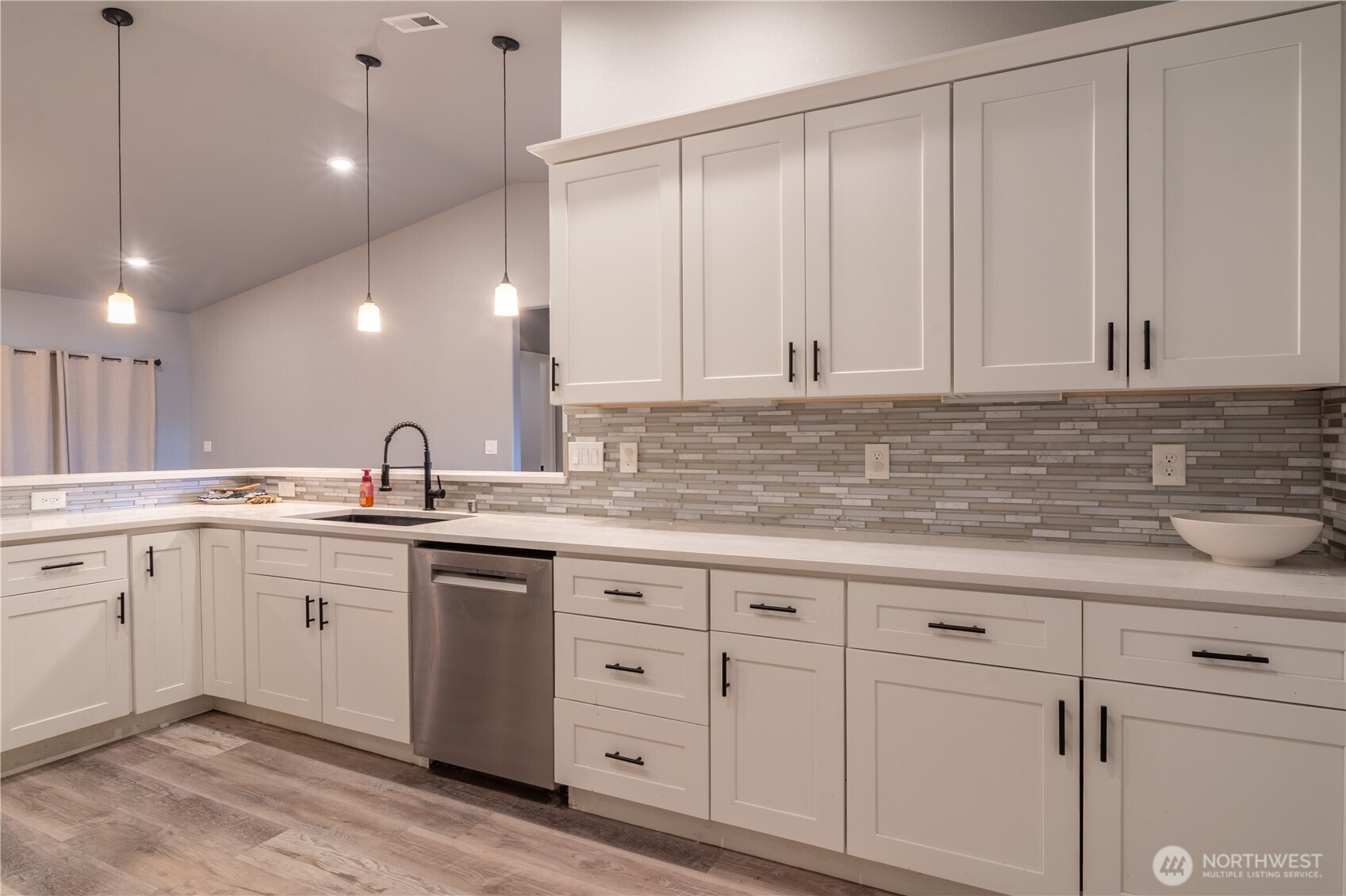 352 East Davis Street Connell, WA 99326 - Photo 11 of 35 a kitchen with white cabinets and sink