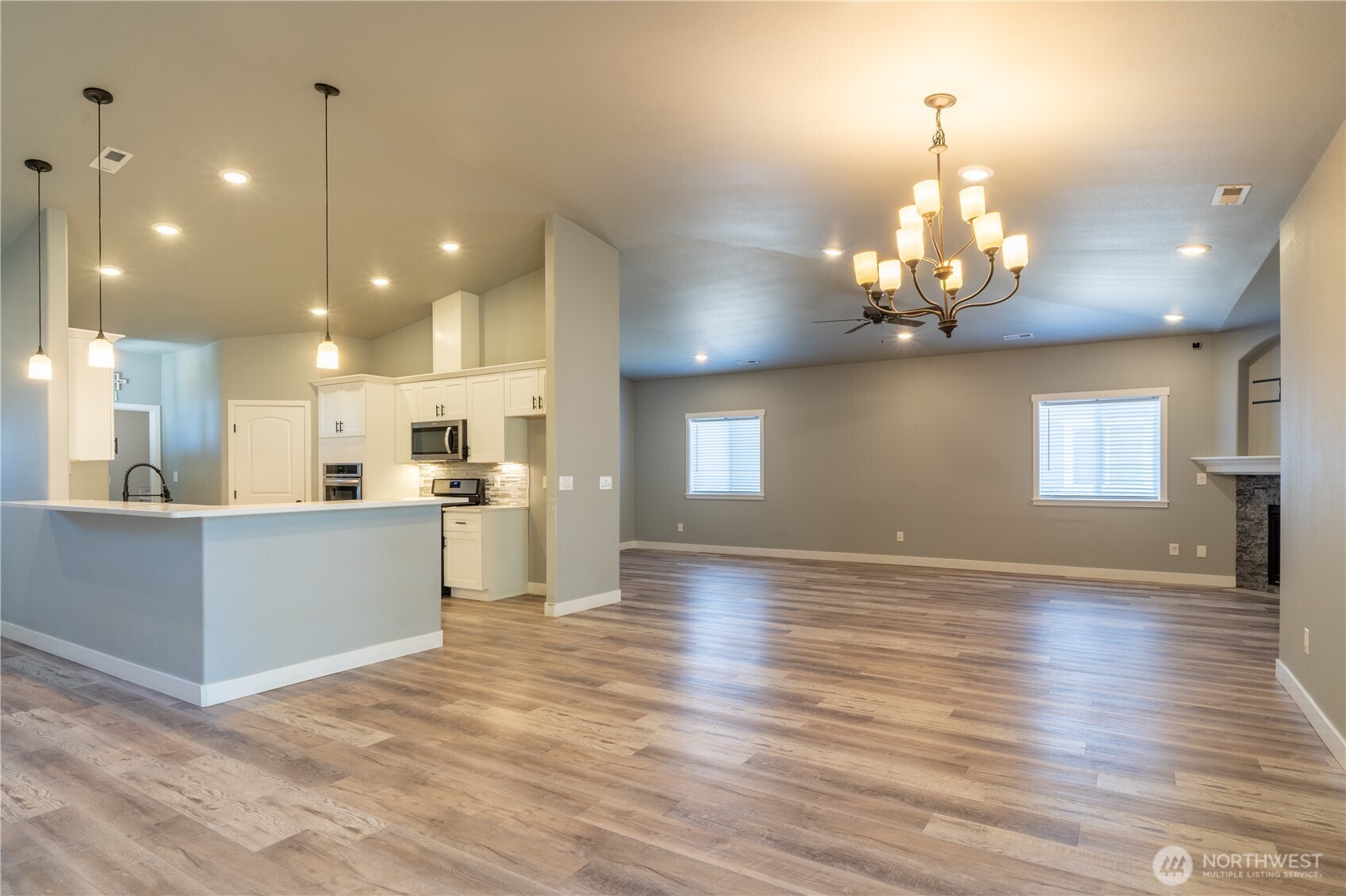 352 East Davis Street Connell, WA 99326 - Photo 12 of 40 a view of a kitchen with sink and wooden floor