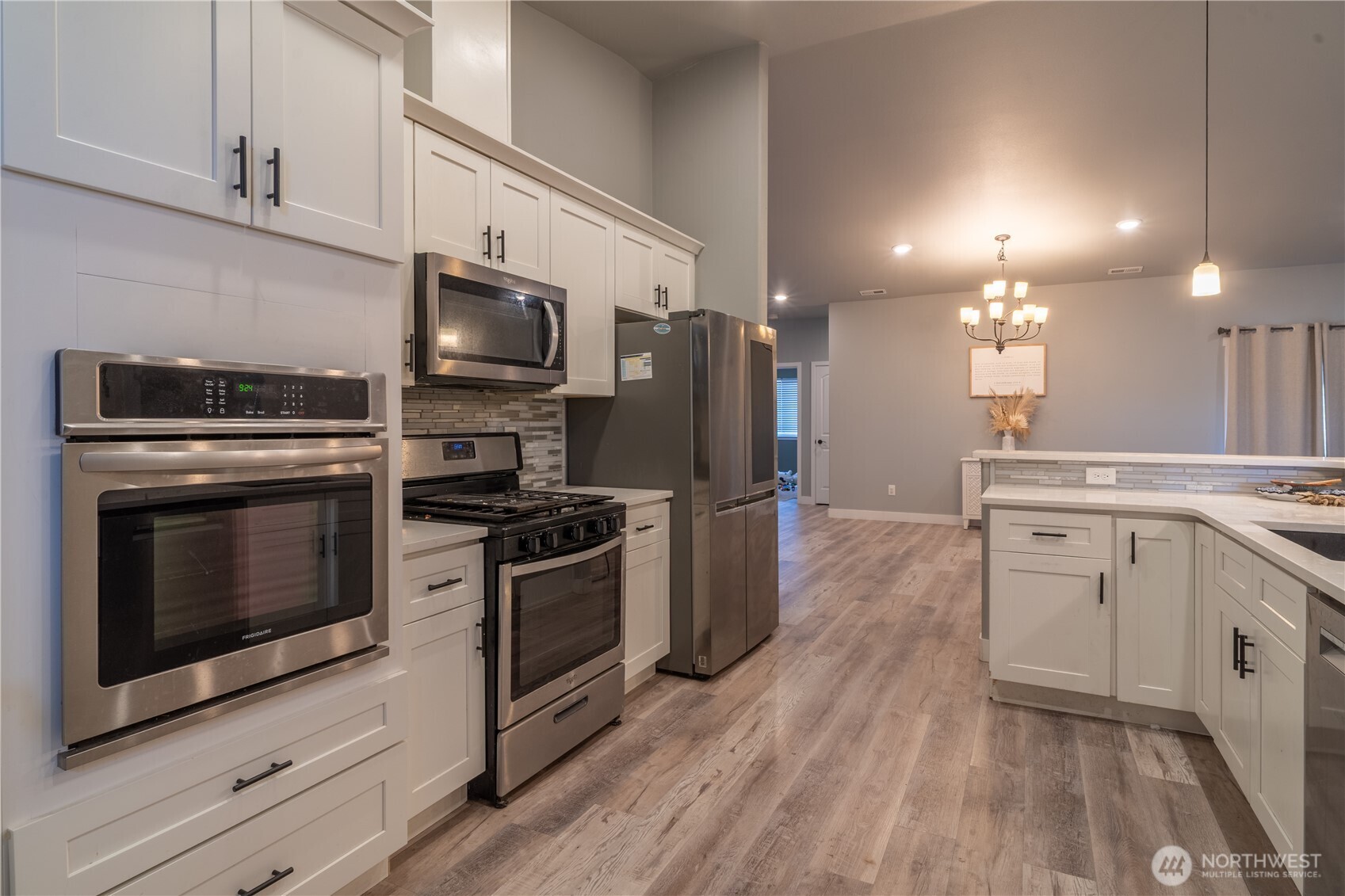 352 East Davis Street Connell, WA 99326 - Photo 12 of 35 a kitchen with stove cabinets and stainless steel appliances