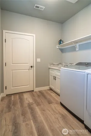 a view of cabinets with wooden floor