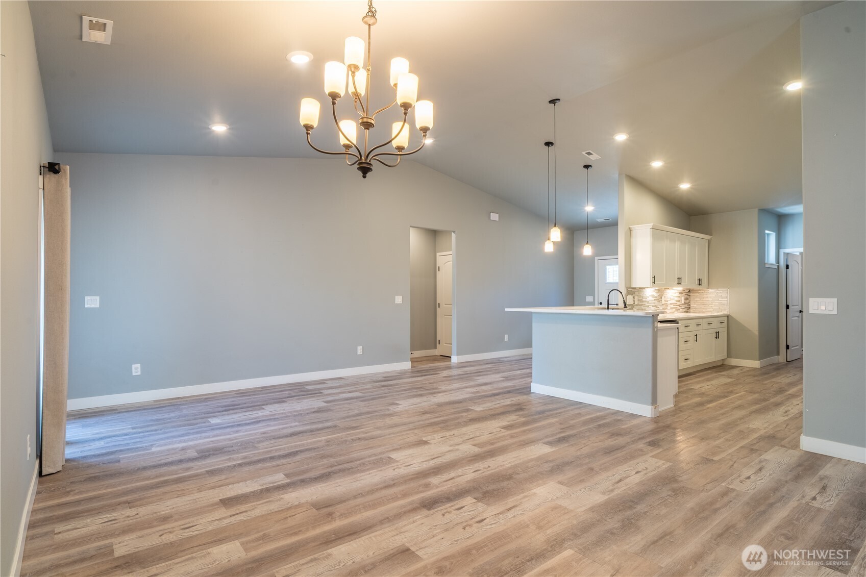 352 East Davis Street Connell, WA 99326 - Photo 13 of 40 a view of a kitchen with a sink and chandelier