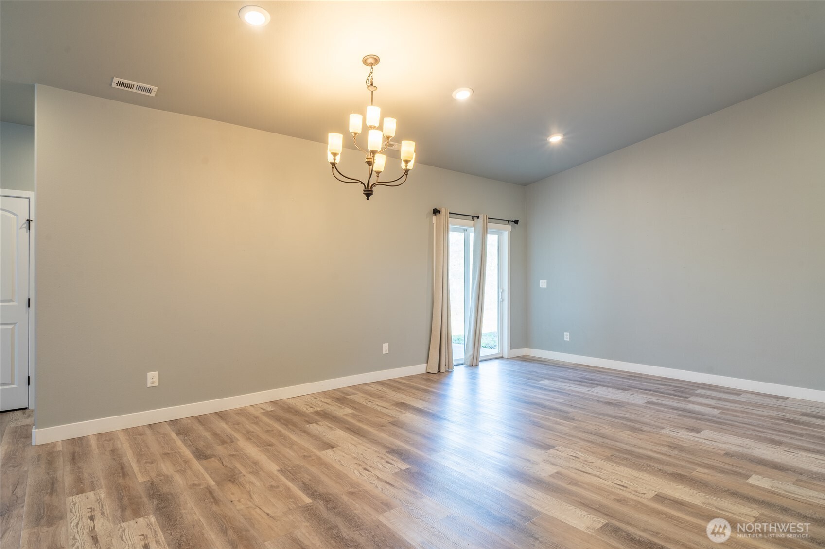 352 East Davis Street Connell, WA 99326 - Photo 14 of 40 wooden floor in an empty room with a window