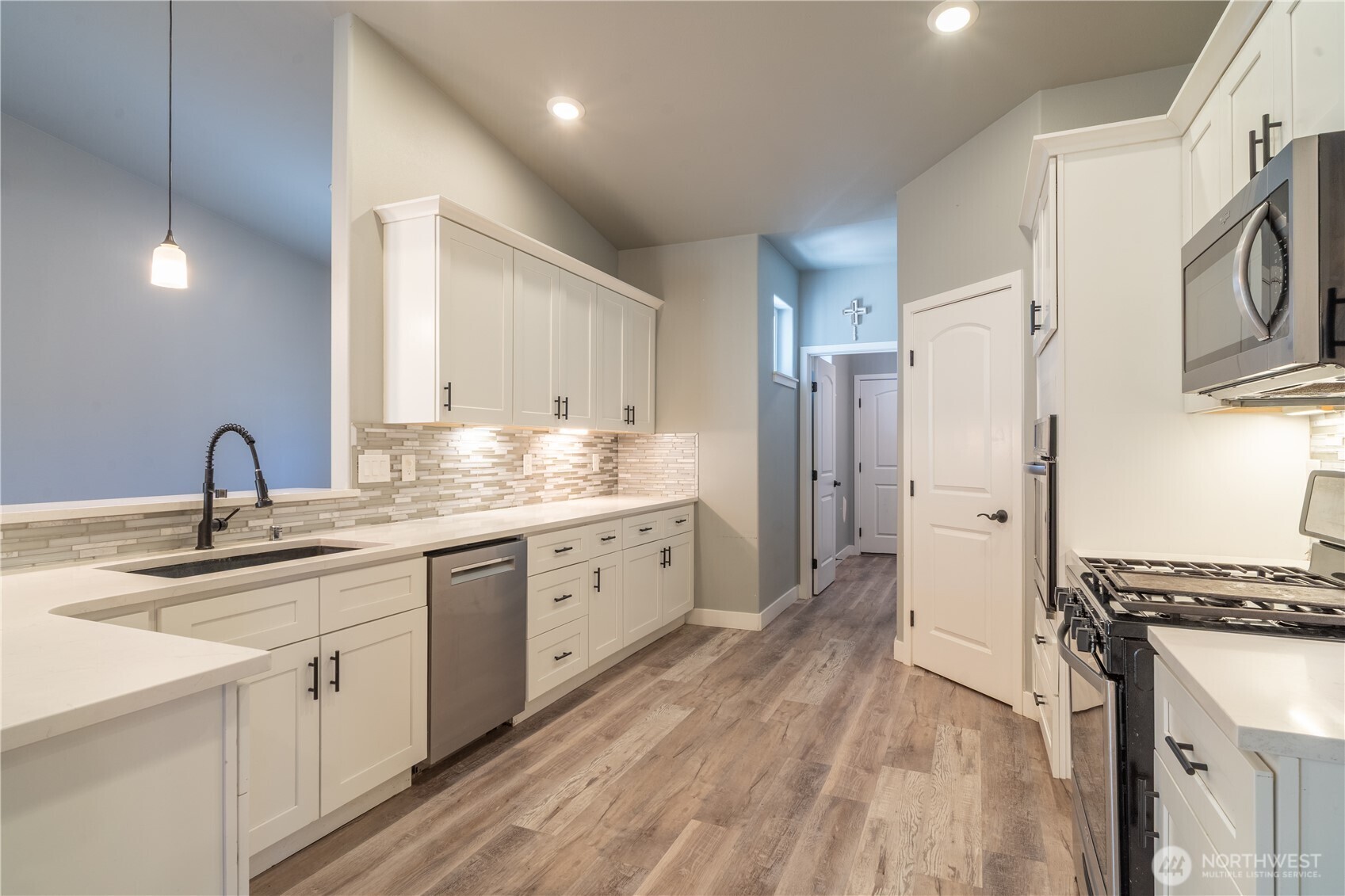 352 East Davis Street Connell, WA 99326 - Photo 15 of 40 a spacious bathroom with a granite countertop sink a toilet a shower and a mirror