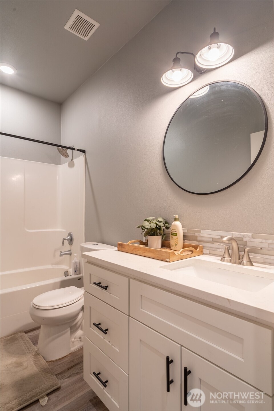 352 East Davis Street Connell, WA 99326 - Photo 18 of 35 a bathroom with a toilet a sink and a mirror