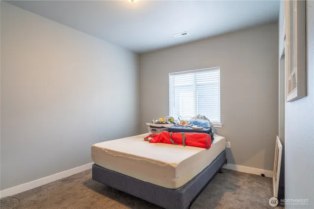 an empty room with closet area