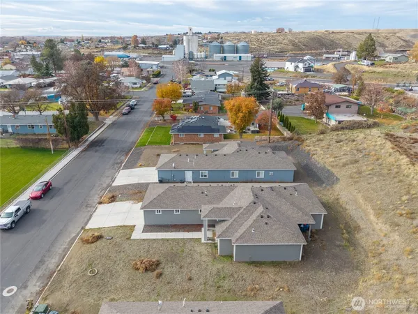an aerial view of a house with a yard lake view