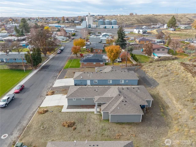 an aerial view of a house with a yard lake view