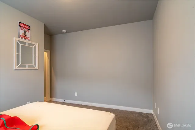 a bedroom with a bed and a shower