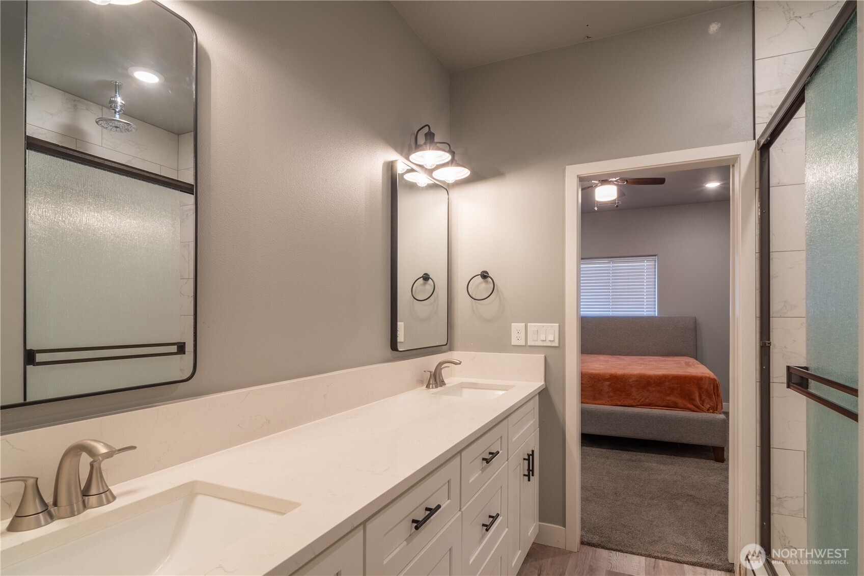 352 East Davis Street Connell, WA 99326 - Photo 25 of 40 a en suite bathroom with a sink and a large mirror