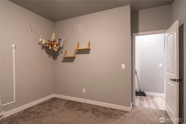 an empty room with closet area