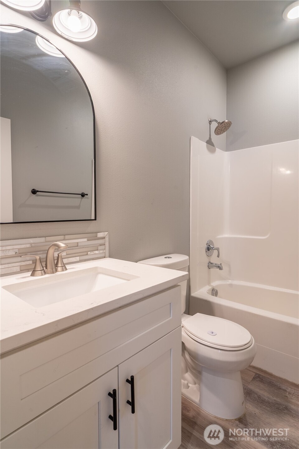 352 East Davis Street Connell, WA 99326 - Photo 27 of 40 a bathroom with a sink a toilet and a mirror