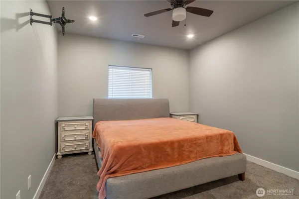 a bedroom with a bed and a shower
