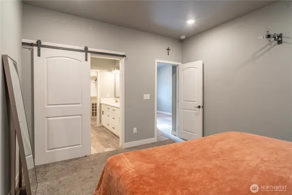 a bathroom with a double vanity sink mirror and