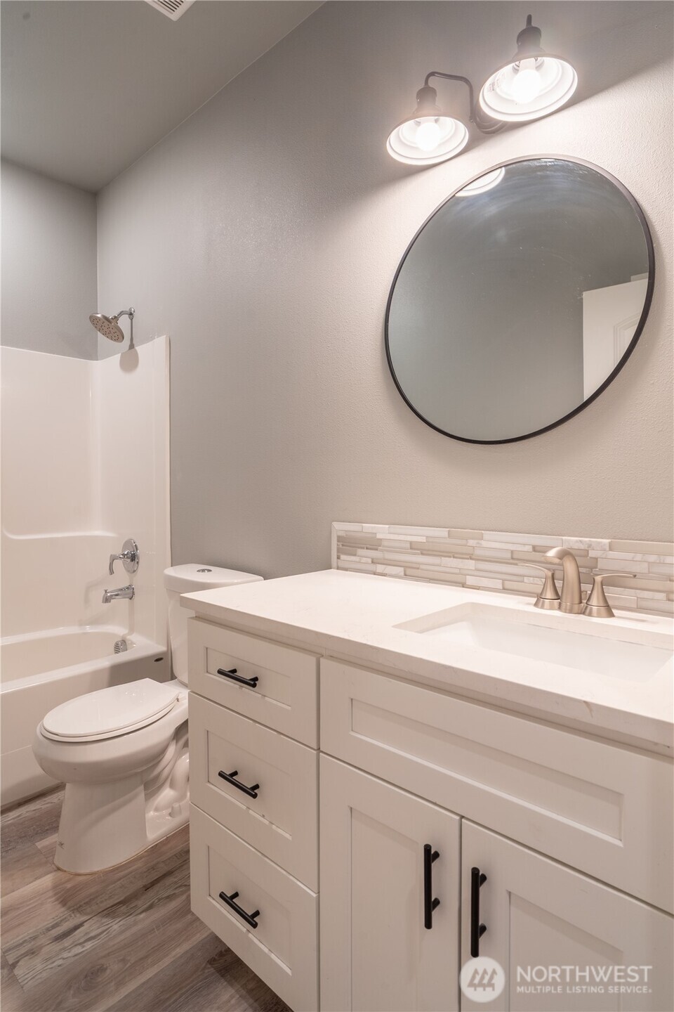 352 East Davis Street Connell, WA 99326 - Photo 34 of 40 a bathroom with a toilet a sink and mirror