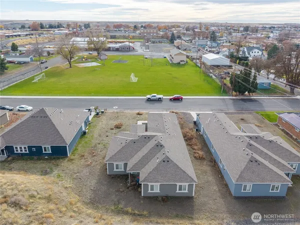an aerial view of a house with a swimming pool