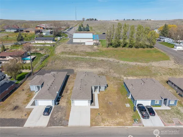 an aerial view of a house with a swimming pool