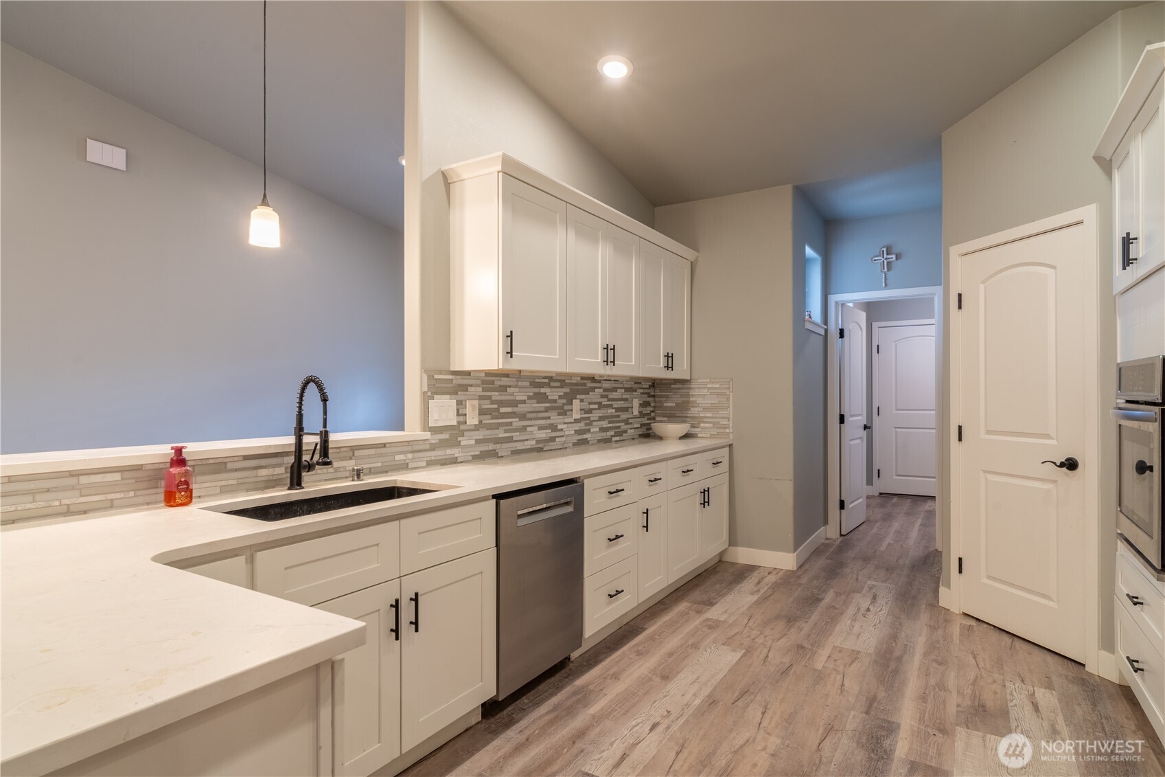 352 East Davis Street Connell, WA 99326 - Photo 10 of 35 a kitchen with white cabinets and sink